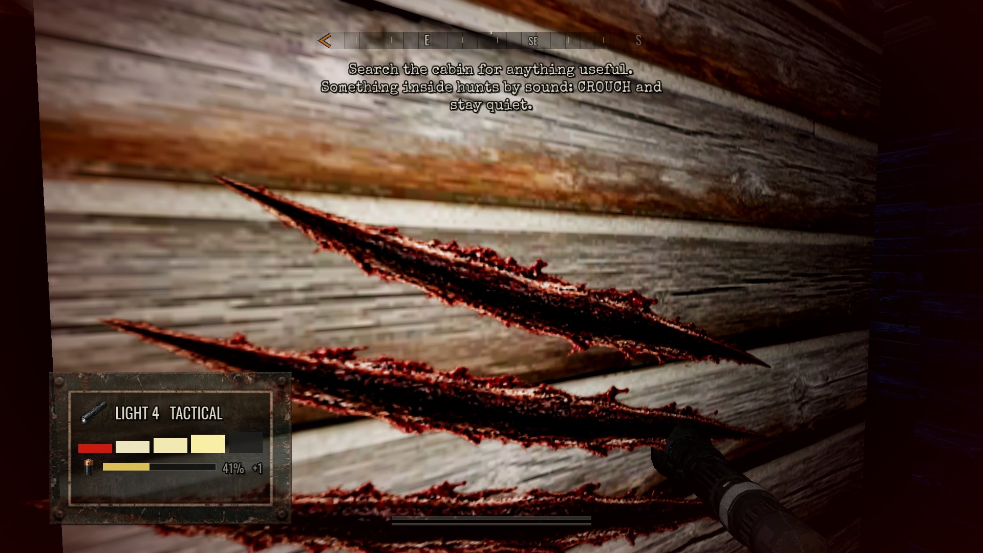 Claw marks on the cabin wall. The thing inside hunts by sound, so crouch and stay quiet.
